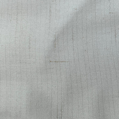 Close-up of Jinchan off-white linen blend fabric, showcasing the textured weave and light filtering quality of the curtains.