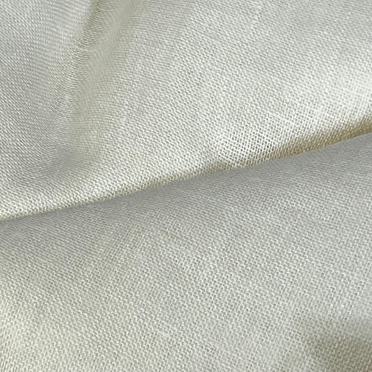 Close-up of Solino Home ivory linen sheer curtain fabric, showcasing the fine European flax texture and light filtering quality.