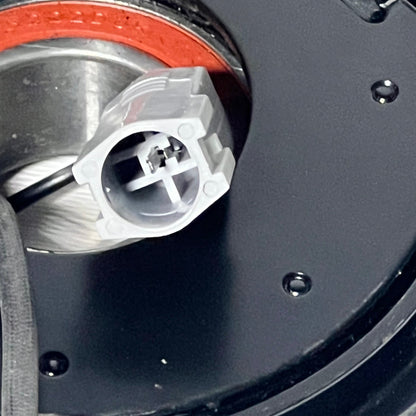 Close-up of electrical connector on uxcell AC Compressor Clutch Set for Mazda 3, focusing on plug detail.