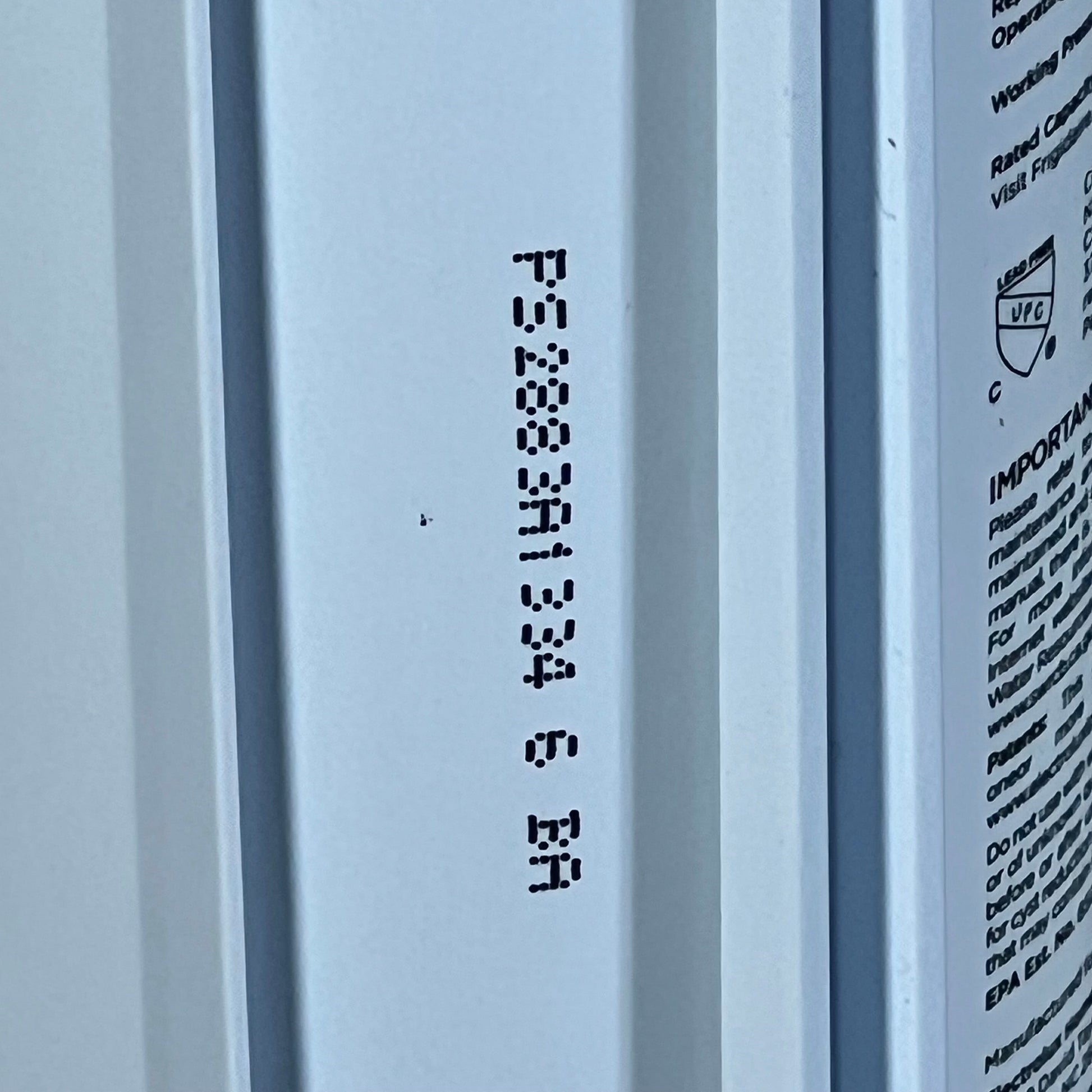 Close-up of Frigidaire WF3CB PureSource3 filter showing product details and text on the side.