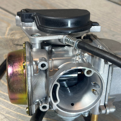 Close-up of MOTOKU carburetor for Suzuki Eiger 400 LTF400, showcasing its detailed construction.