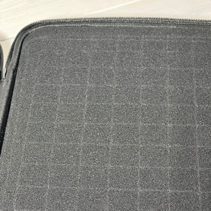 Close-up of pre-cut customizable space sponge in Brappo Miniature Storage Case for secure figure storage.