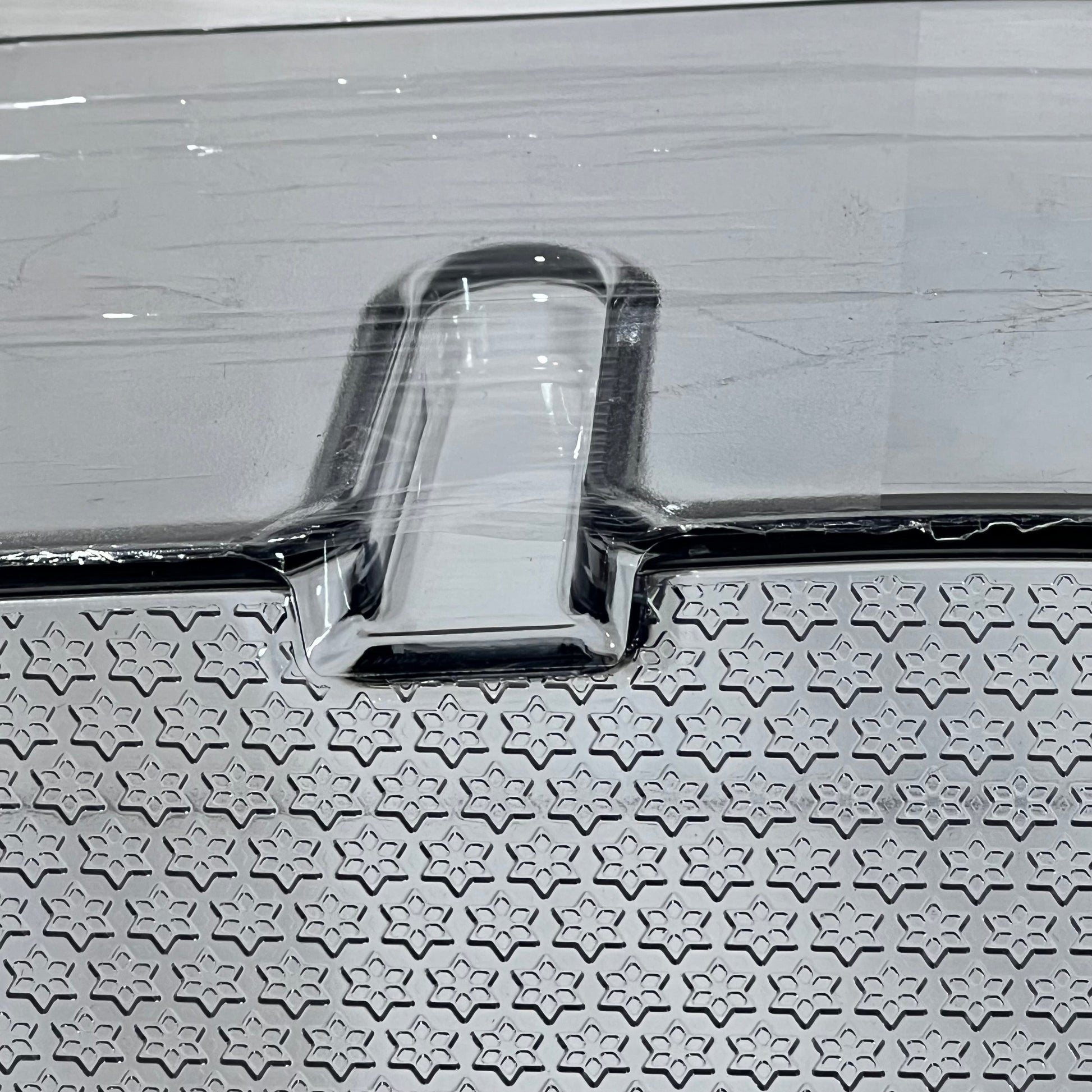 Close-up of textured surface on Samsung refrigerator door shelf bin replacement DA97-21912A.