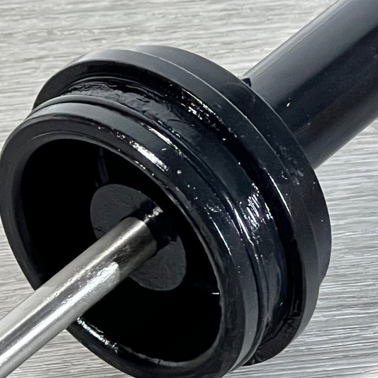 Close-up of the black GUOJINJISM SPX0410BA piston assembly, highlighting the sturdy metal rod and smooth finish.