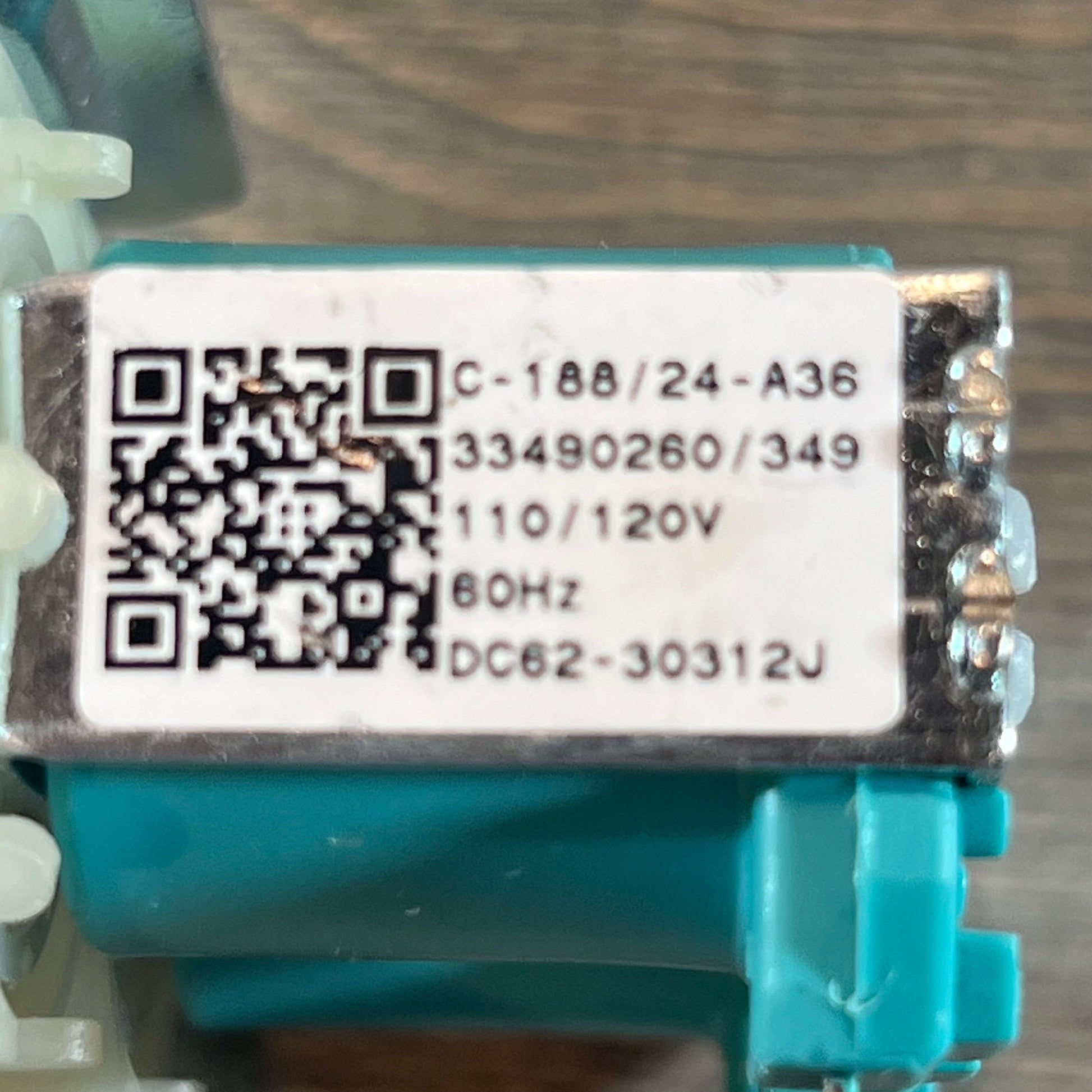 Close-up of the DC62-30312J water valve label for Kenmore Samsung washer replacement by TOMOON.