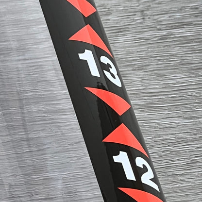 Close-up of the golf ball retriever tool's measuring marks on the 36-inch plastic tube.