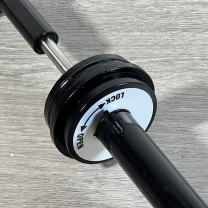 Close-up of the GUOJINJISM SPX0410BA handle showing lock and open positions on a sleek black piston assembly.