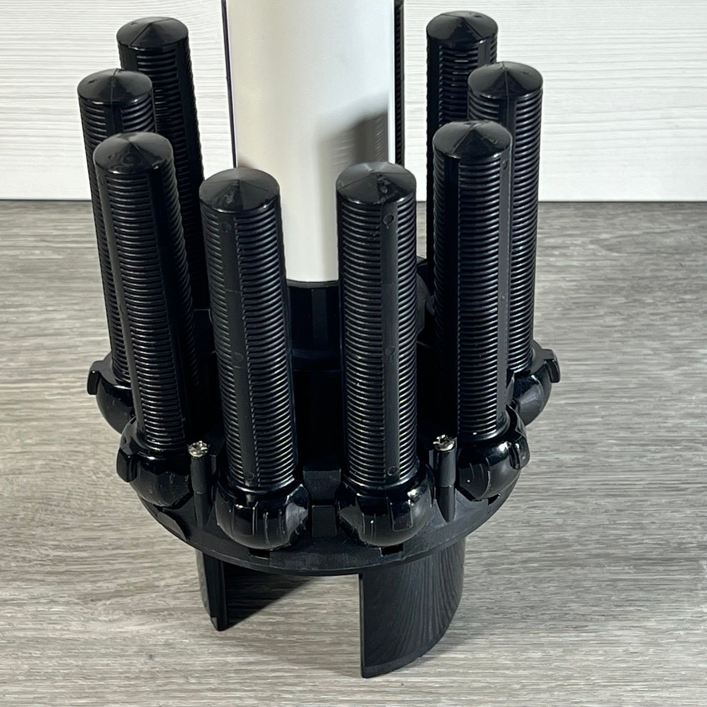 Close-up of TIROAR SX164DA Lateral Assembly with center pipe, suitable for Hayward filter systems, on wooden surface.