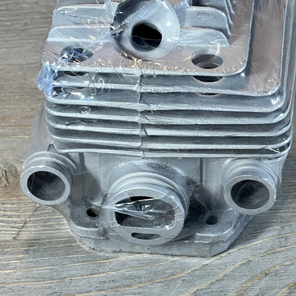 Close-up of Yingspart 56mm cylinder piston kit for Stihl TS700 TS800, showcasing detailed metalwork on a wooden surface.
