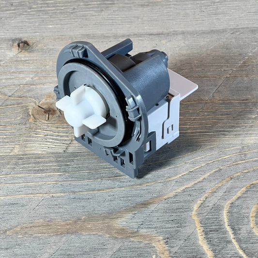 Close-up view of a durable dishwasher drain pump assembly compatible with Kenmore Frigidaire models 2718A.