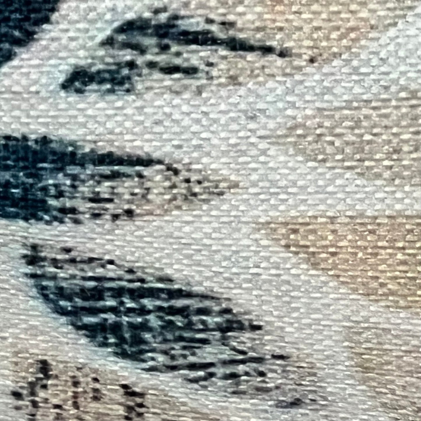 Close-up of navy blue cream dahlia lumbar pillow cover fabric, showcasing rustic geometric floral design and linen texture.