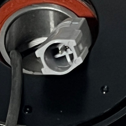 Close-up view of the connector on the 1048525440-uxcell AC Compressor Clutch Set for Mazda 3, 2010-2013 models.