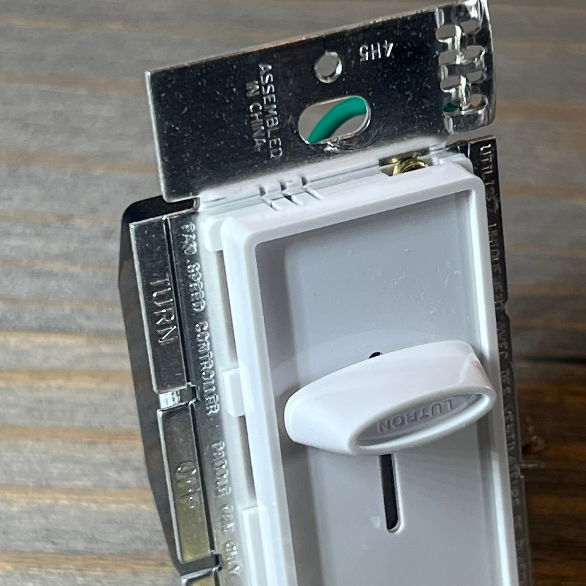 Close-up view of the Lutron Skylark Fan Control, featuring a white slider for adjusting fan speed.