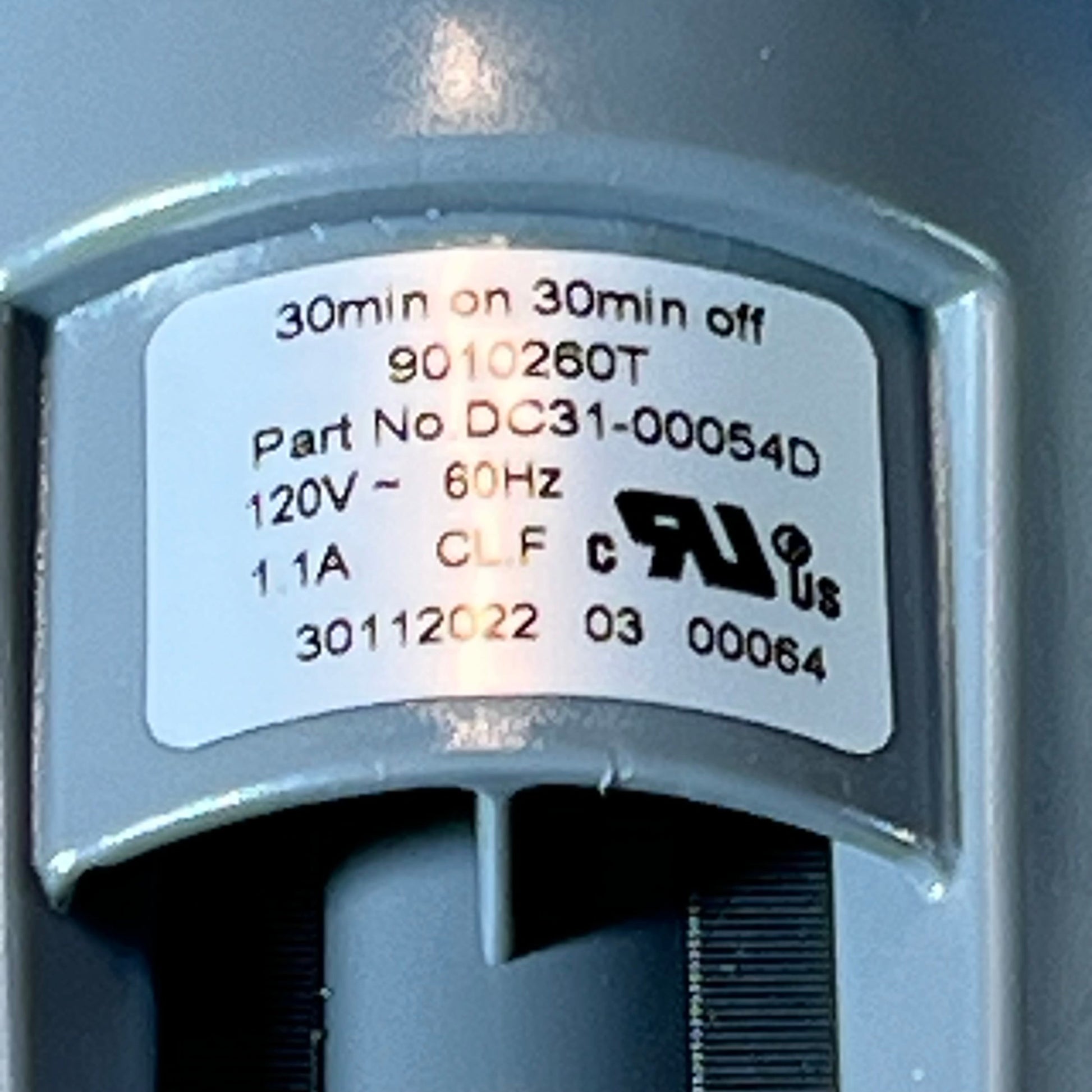 Close-up view of the Supco LP054D Washer Drain Pump label, showing specifications and part number DC31-00054D.