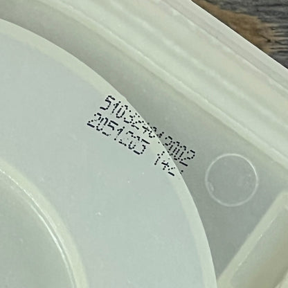 Close-up view of the Supplying Demand top load washer drain pump and pulley replacement, showing detailed part numbers.