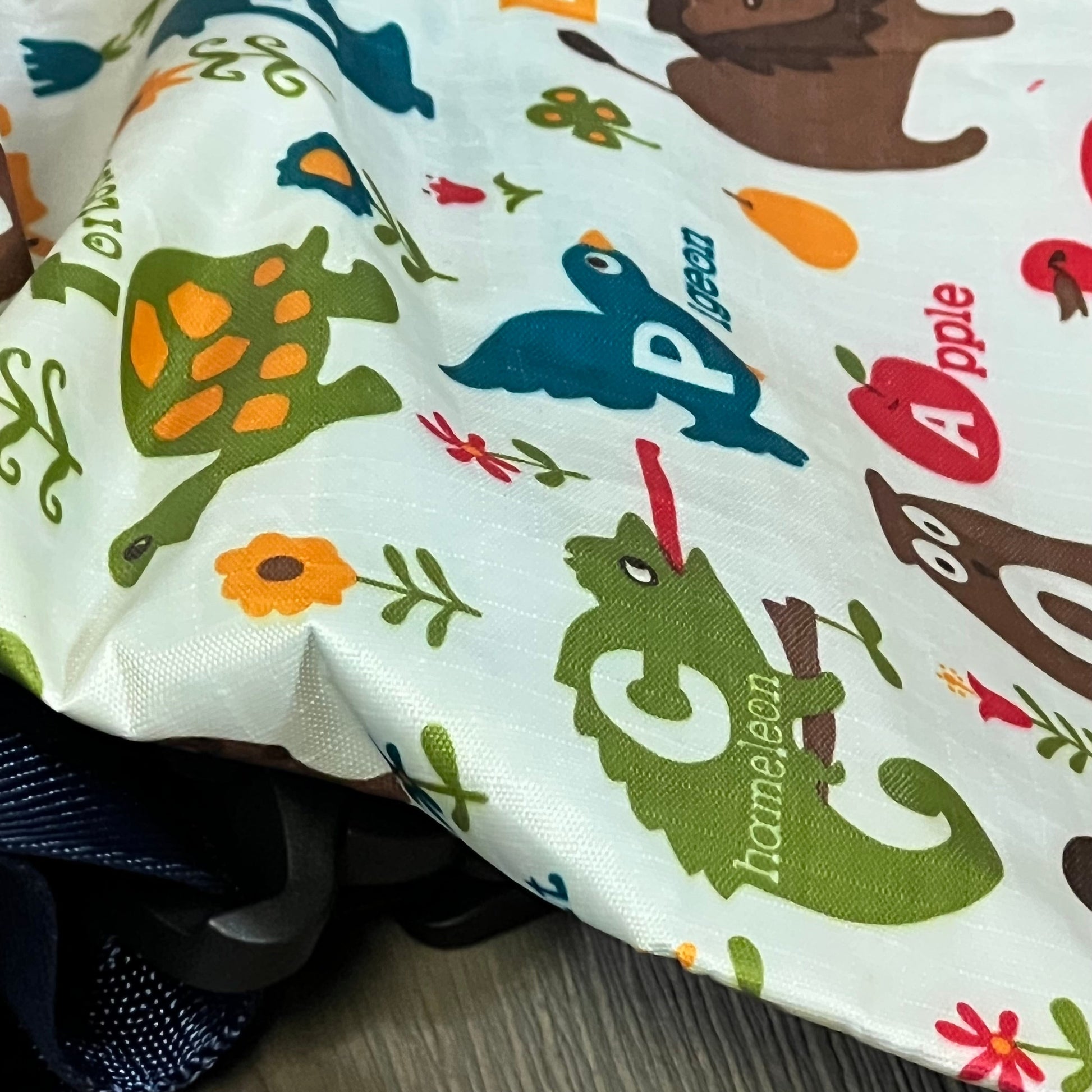 Colorful fabric detail of the 2025 Safety Harness with playful animal designs, ideal for active kids aged 3-6.