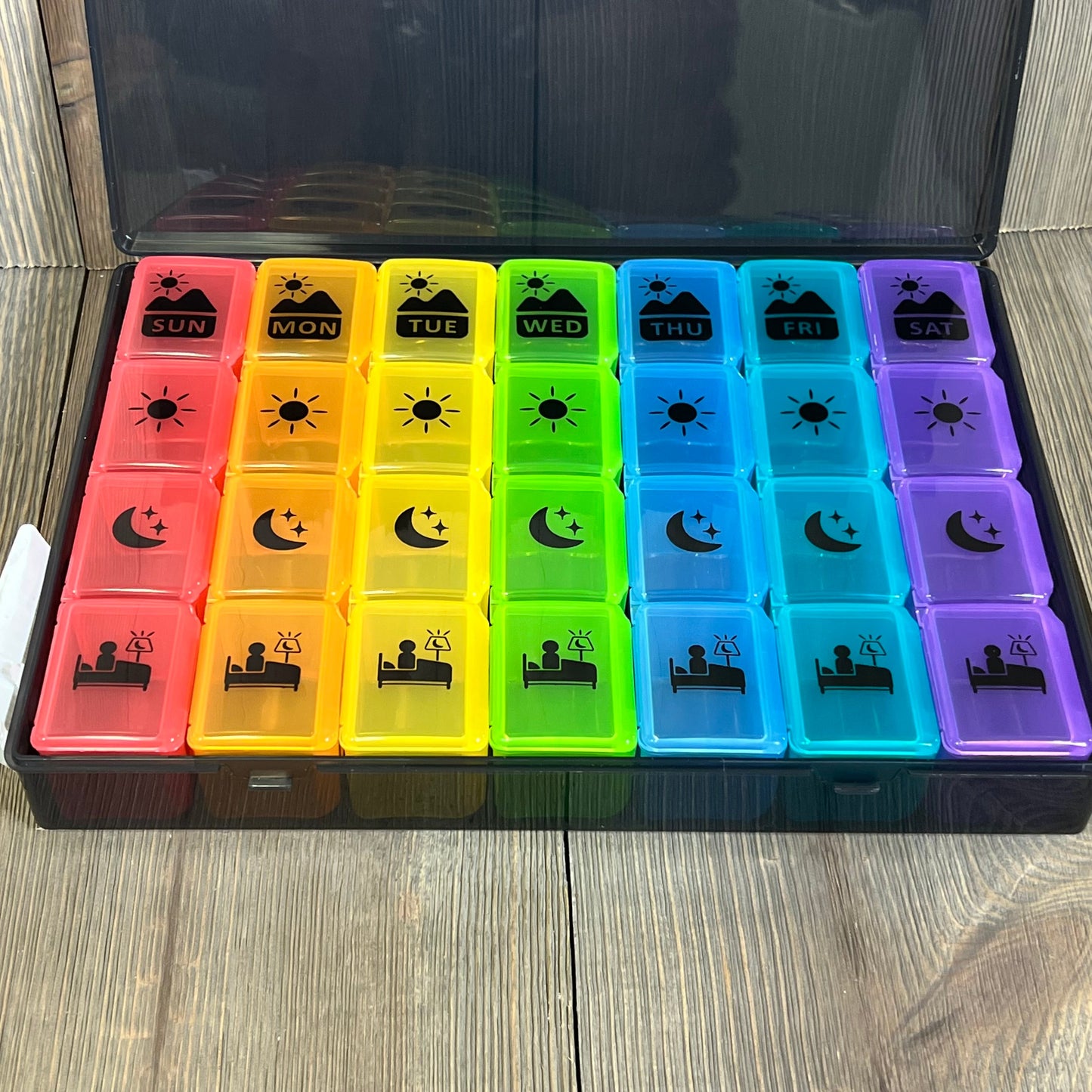 Colorful Extra Large Weekly Pill Organizer with four daily compartments for vitamins and supplements, ideal for easy medication management.