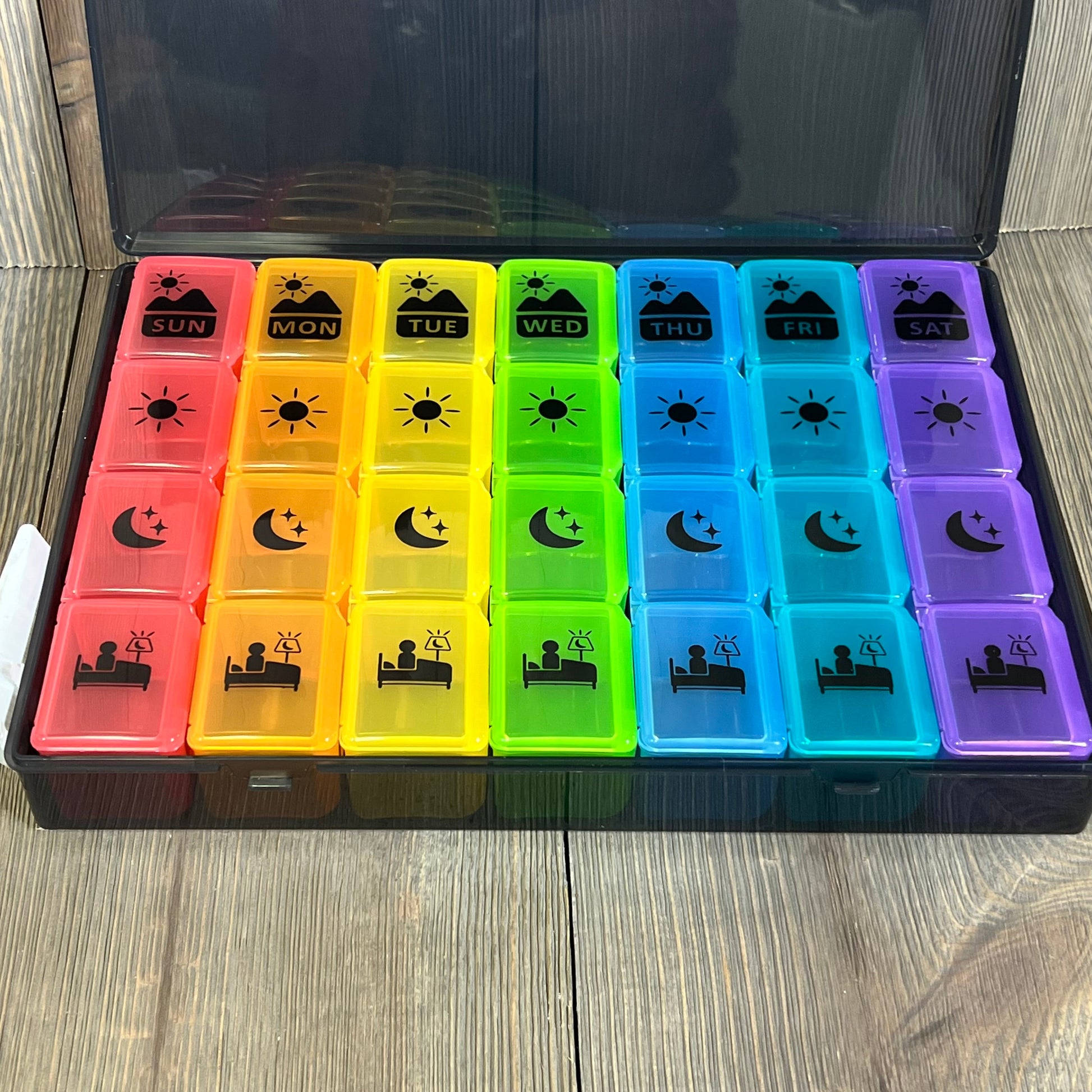 Colorful Extra Large Weekly Pill Organizer with four daily compartments for vitamins and supplements, ideal for easy medication management.