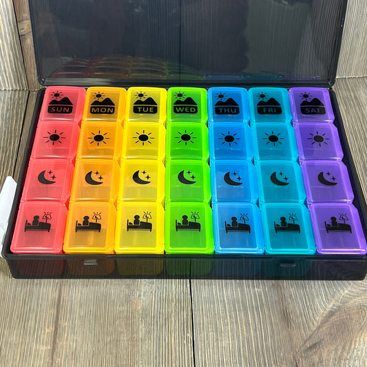 Colorful Extra Large Weekly Pill Organizer with four daily compartments for vitamins and supplements, ideal for easy medication management.