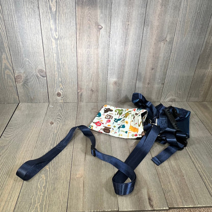 Colorful child safety harness with adjustable leash and autism awareness print, ideal for active kids aged 3-6.