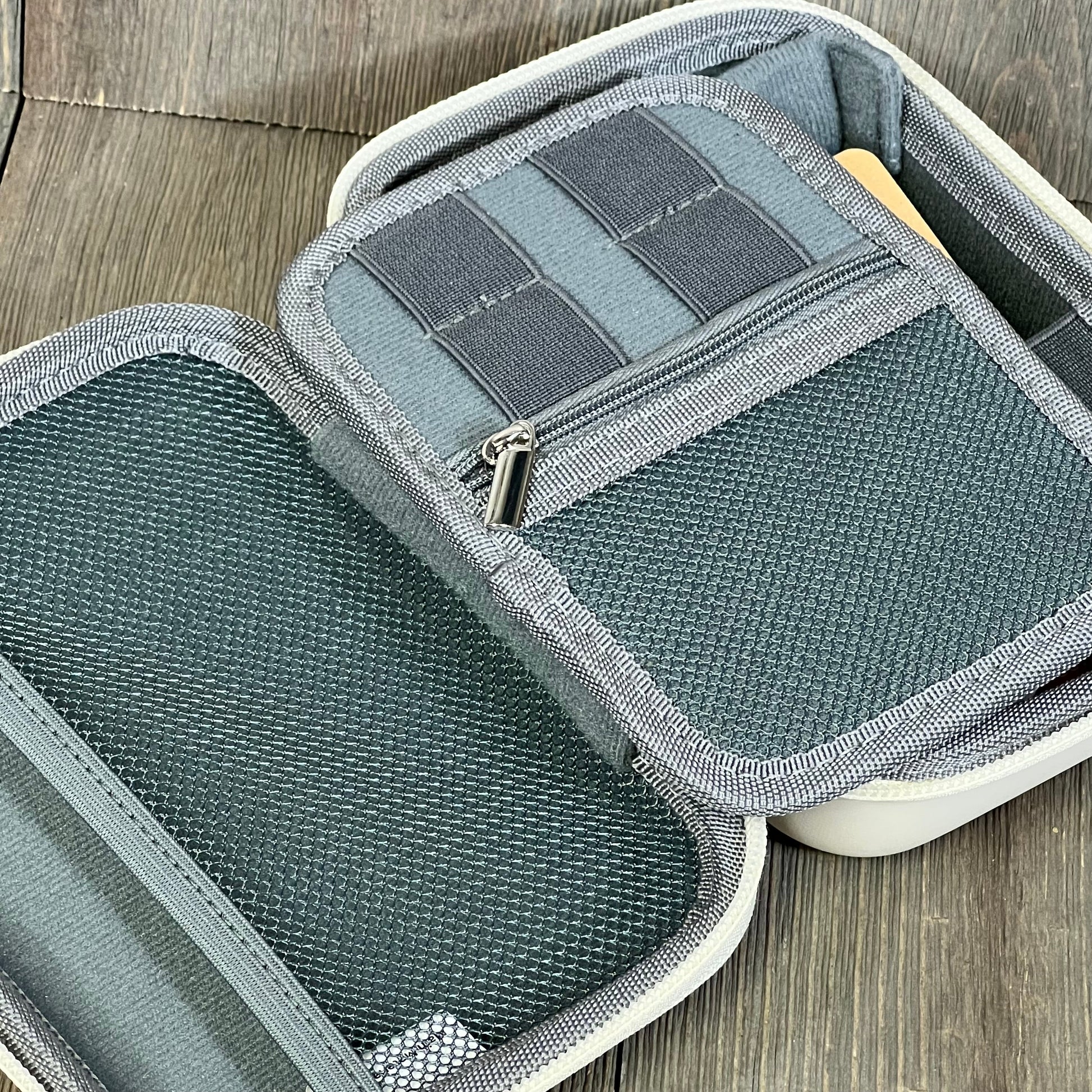 Beige K&F Concept camera bag interior with secure mesh pockets and multiple compartments for organized storage.