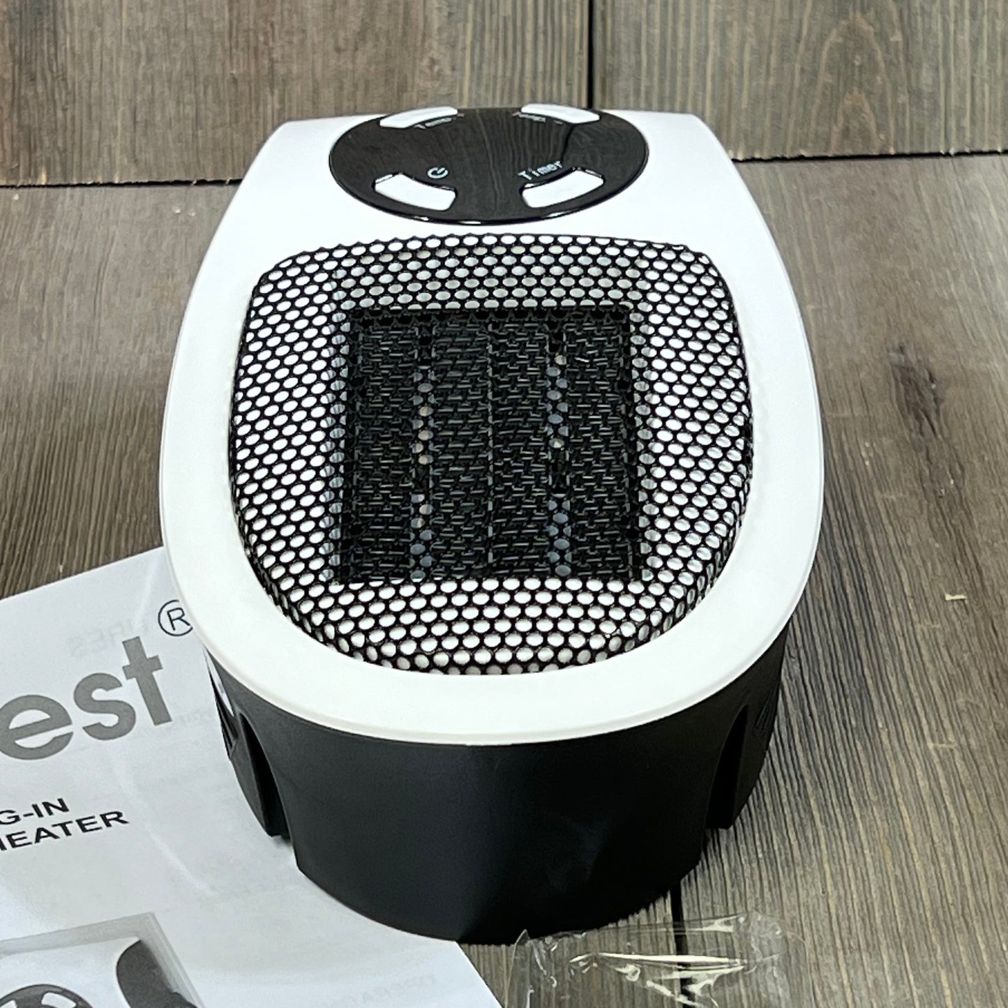 Compact GiveBest space heater with LED display and remote, perfect for home or office use, shown on a wooden floor.