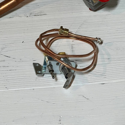 Copper tubing and connectors for gas water heater valve, part of the natural gas thermostat control assembly.