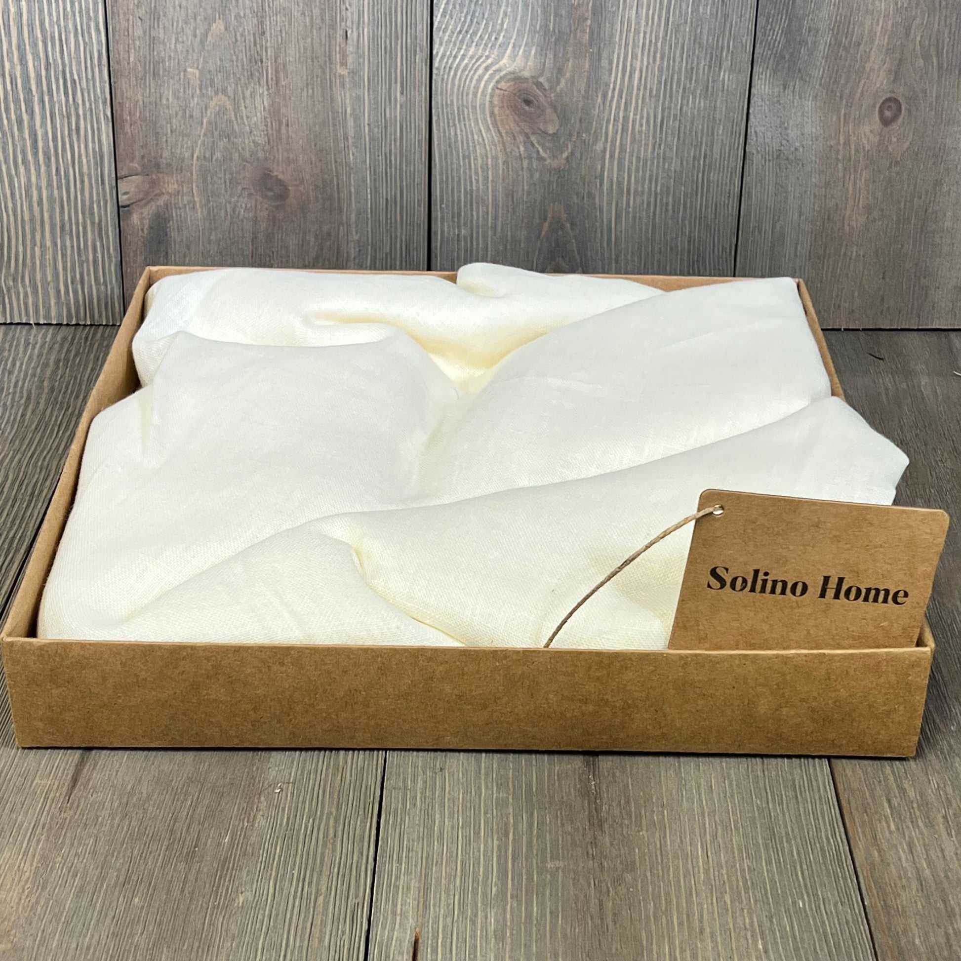Ivory linen sheer curtain from Solino Home, neatly packaged in a box, showcasing premium European flax fabric.