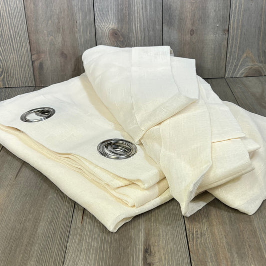 Ivory sheer weatherproof curtain panel with grommet top, perfect for patio or pergola. Extra-wide, elegant design.