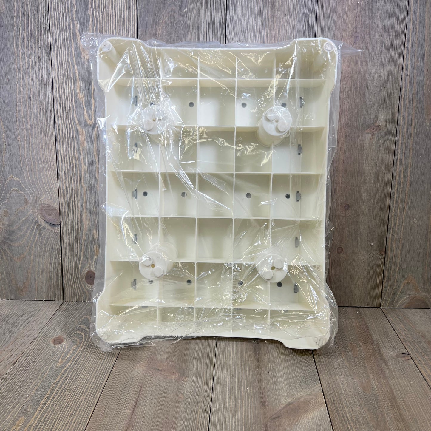 Plastic-wrapped white base of HBTower Step Stool featuring non-slip design, suitable for indoor and outdoor use.