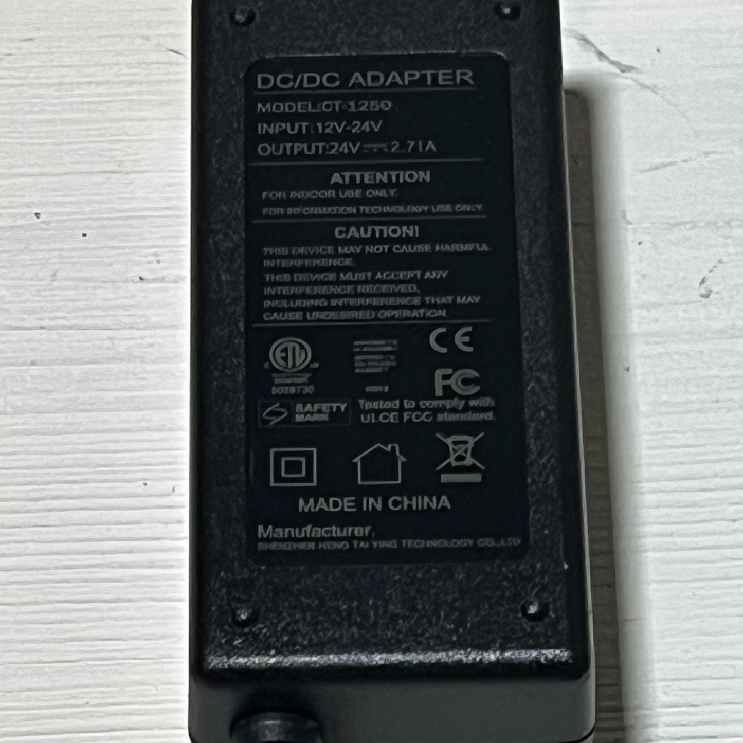 12V DC adapter for Resmed Airsense 11, showcasing model specifications and safety certifications on a white surface.