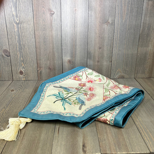 Elegant beige pink floral velvet table runner with tassels, showcasing wildflower design, perfect for dining or coffee tables.