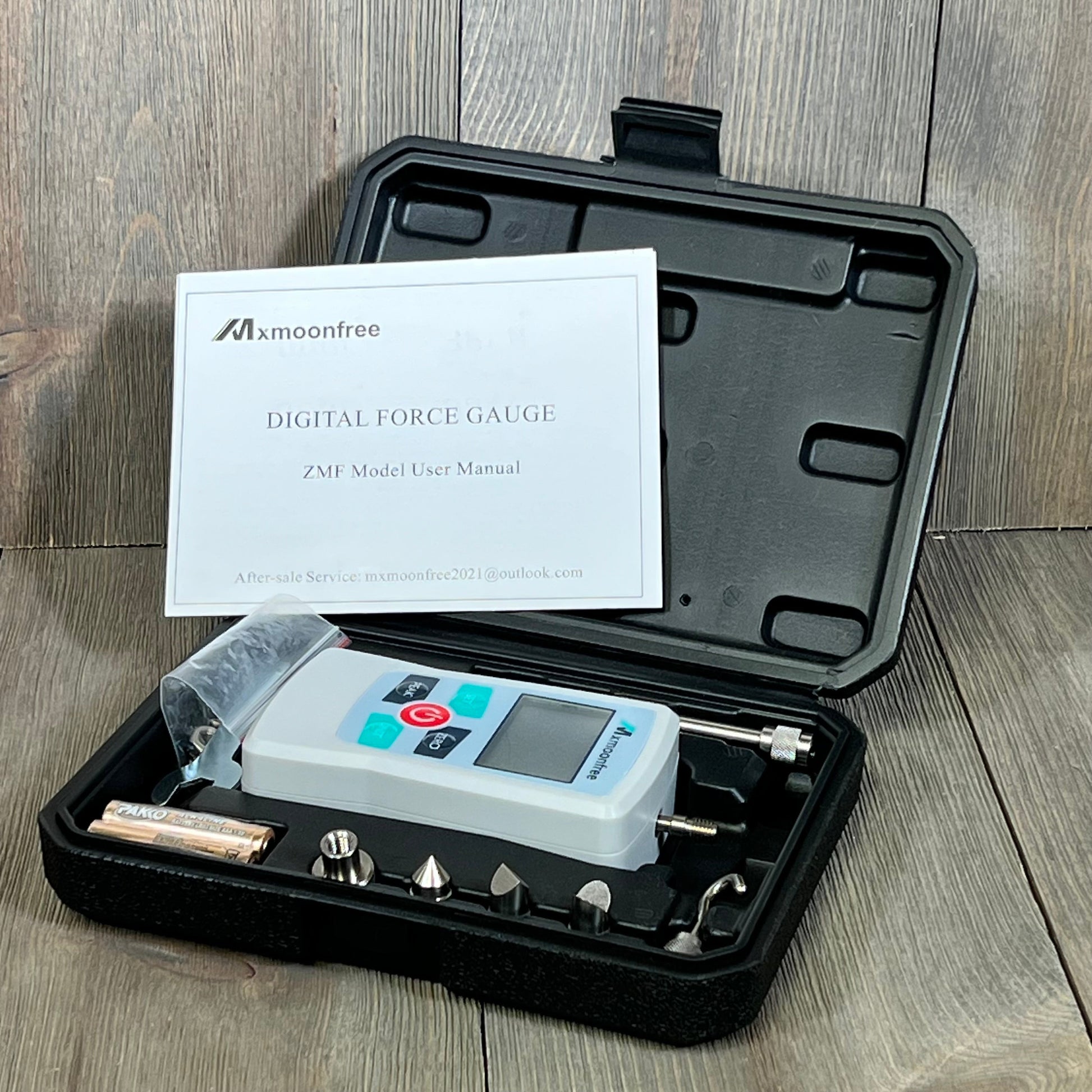 Mxmoonfree 500N digital force gauge with user manual and accessories in a black storage case for labs and teaching.