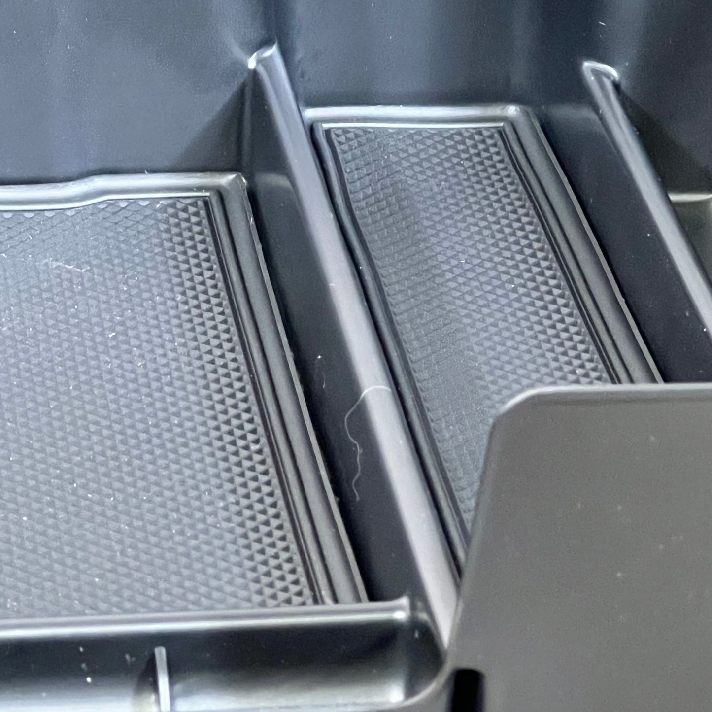 Black full-size center console organizer with textured compartments for Chevy Silverado 1500/GMC Sierra 1500 (2019-2022).