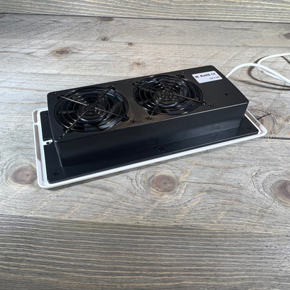 Dual-fan smart register booster for 4" x 10" vents, enhancing airflow efficiency with remote control.