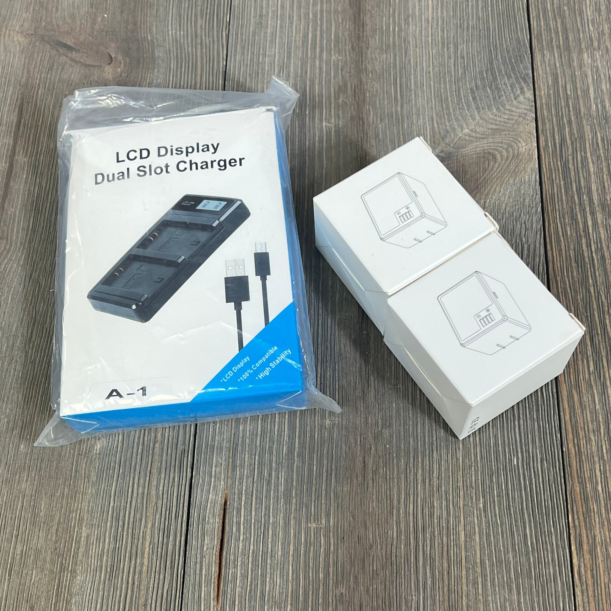 LCD dual slot charger and packaging for 2-pack rechargeable A-1 VMA4400 batteries for Arlo Pro cameras.