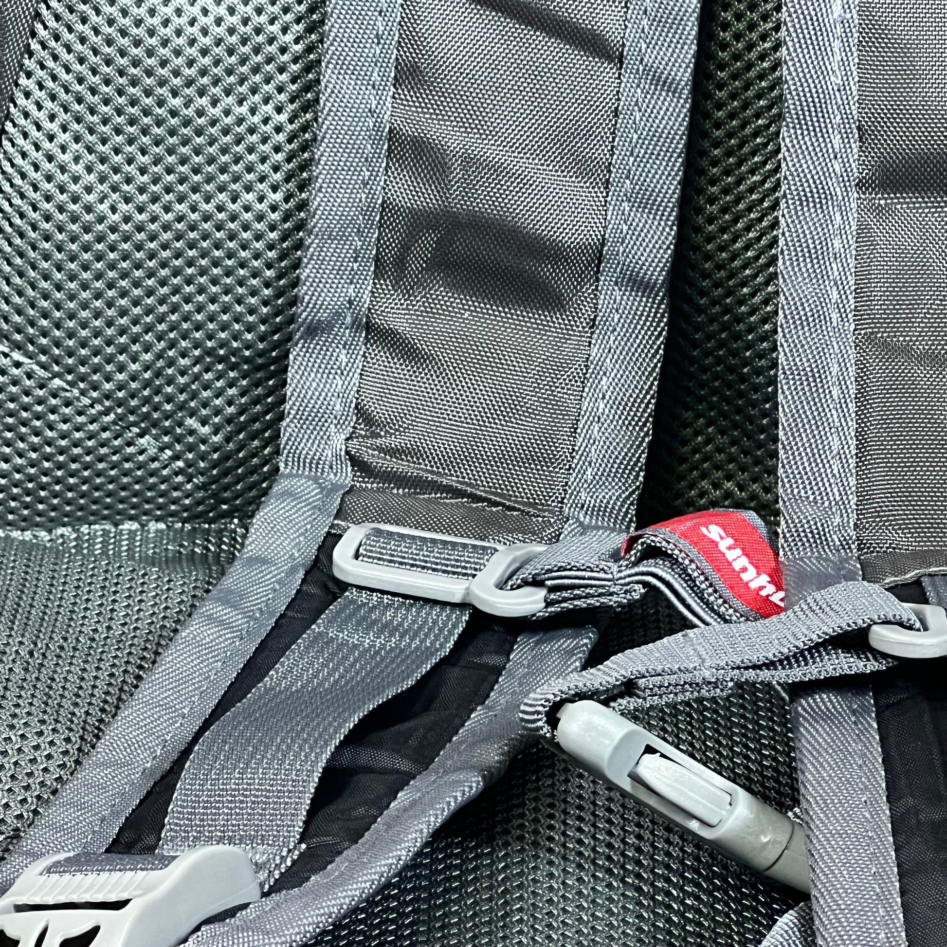 Gray adjustable straps of the Sunhiker lightweight cycling and hiking backpack, showcasing durable stitching and water-resistant fabric.