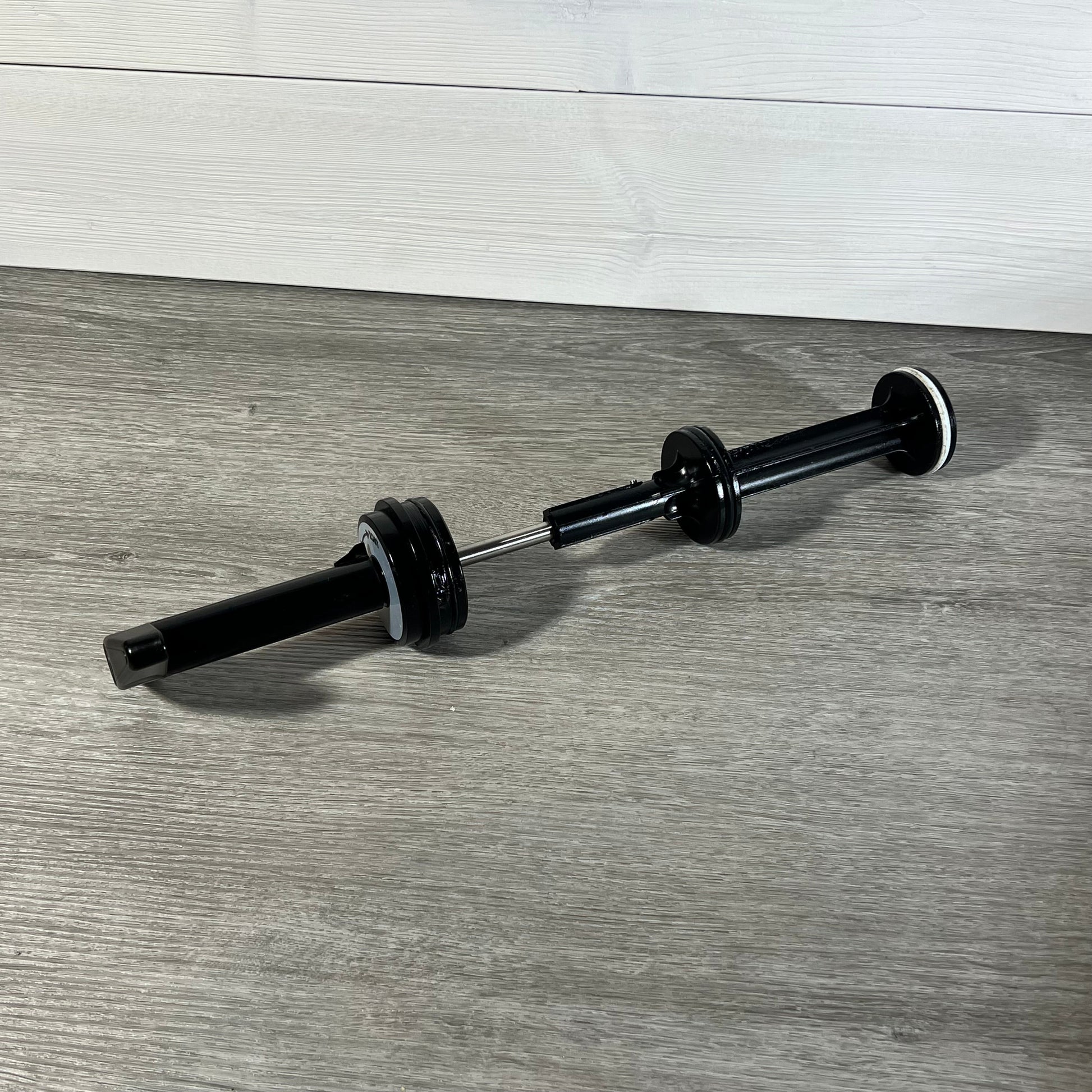 Durable GUOJINJISM SPX0410BA handle and piston assembly for Hayward slide valve on a wooden surface.