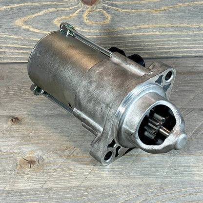 Durable starter motor compatible with Honda Accord, CR-V, Civic 2013-2019, shown on a wooden background.