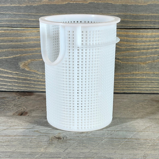 Durable white plastic strainer basket for Pentair Sta-Rite suction trap assembly on a wooden surface.