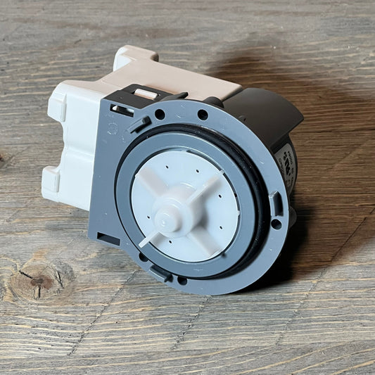 Efficient Supco LP054D washer drain pump, compatible with Samsung DC31-00054D, displayed on wooden surface.