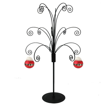 Black metal ornament tree display stand with decorative wire hooks, featuring red Santa-themed Christmas baubles.