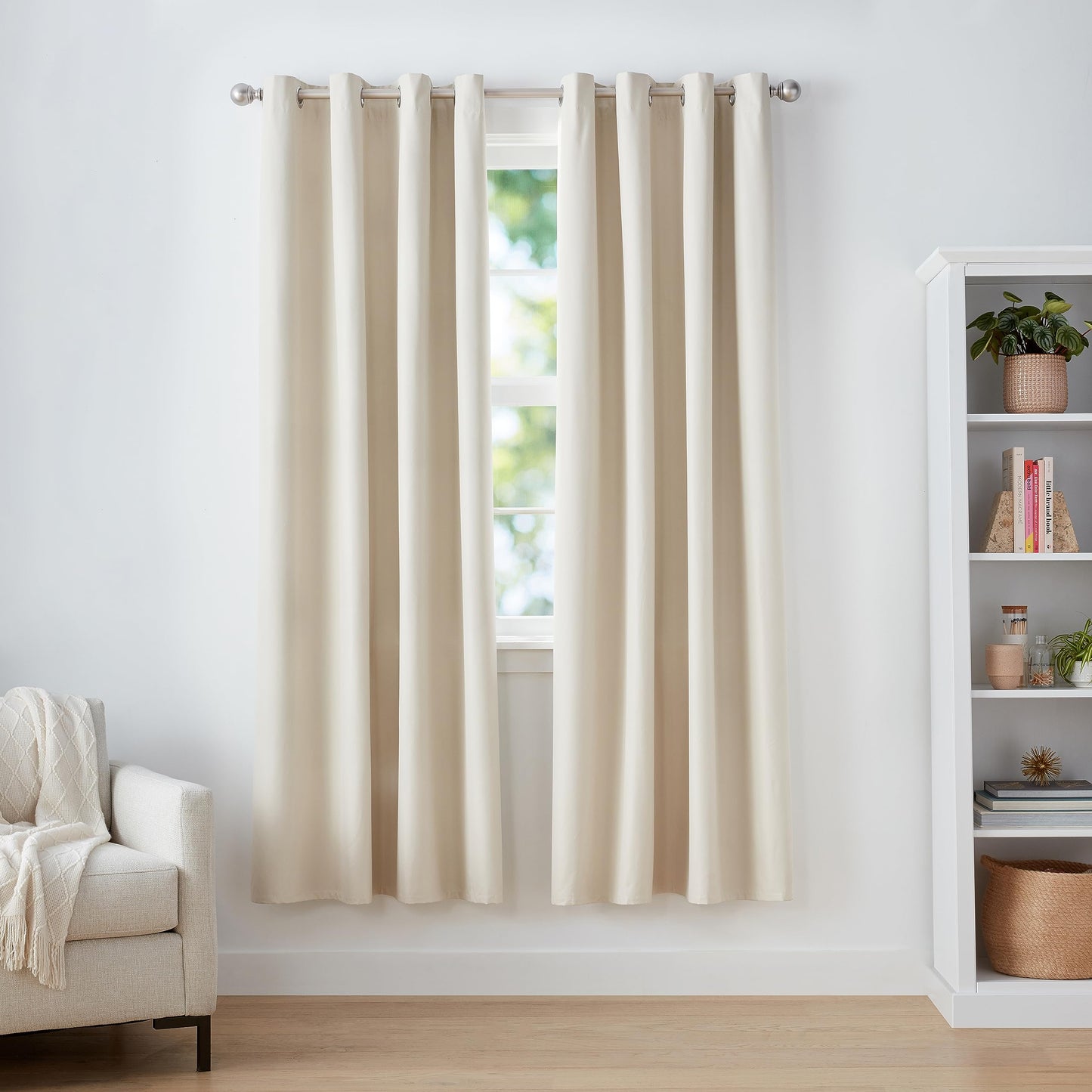 Beige blackout curtains with grommets, enhancing room decor and blocking light, ideal for living room or bedroom, 52x84 inches.