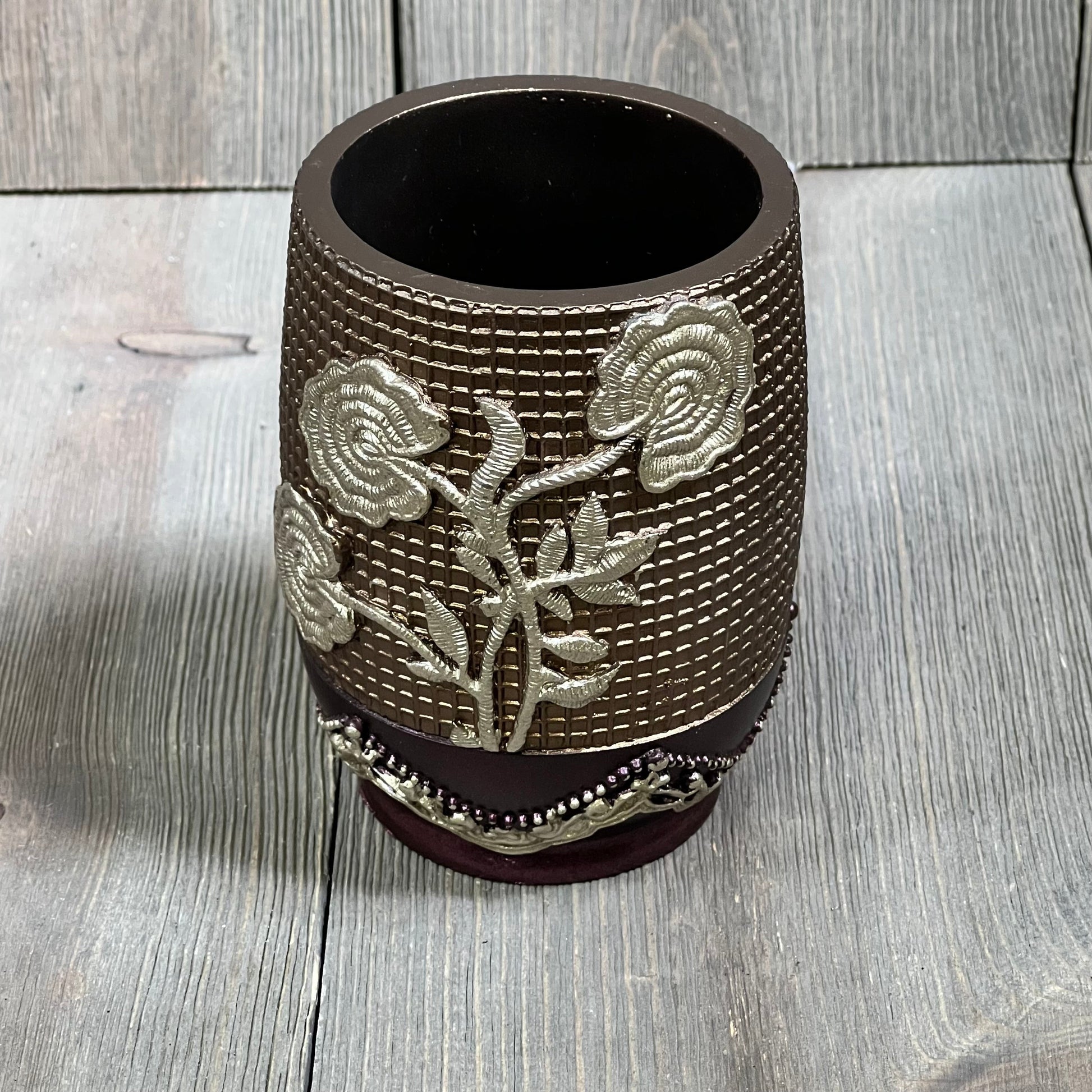 Burgundy tumbler with embossed silver rose design, Popular Bath Ombre collection, elegant bathroom accessory.