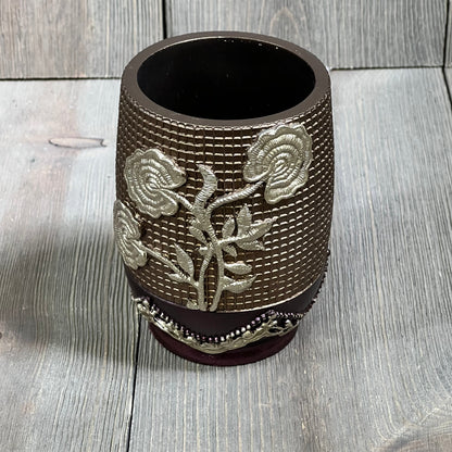 Burgundy tumbler with embossed silver rose design, Popular Bath Ombre collection, elegant bathroom accessory.