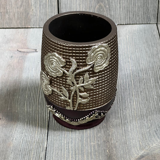 Burgundy tumbler with embossed silver rose design, Popular Bath Ombre collection, elegant bathroom accessory.