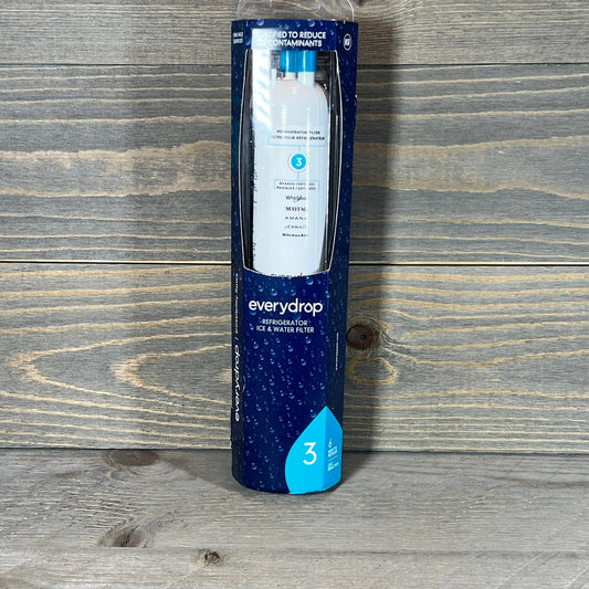 everydrop by Whirlpool refrigerator filter in sleek packaging on wooden surface, designed to reduce contaminants.