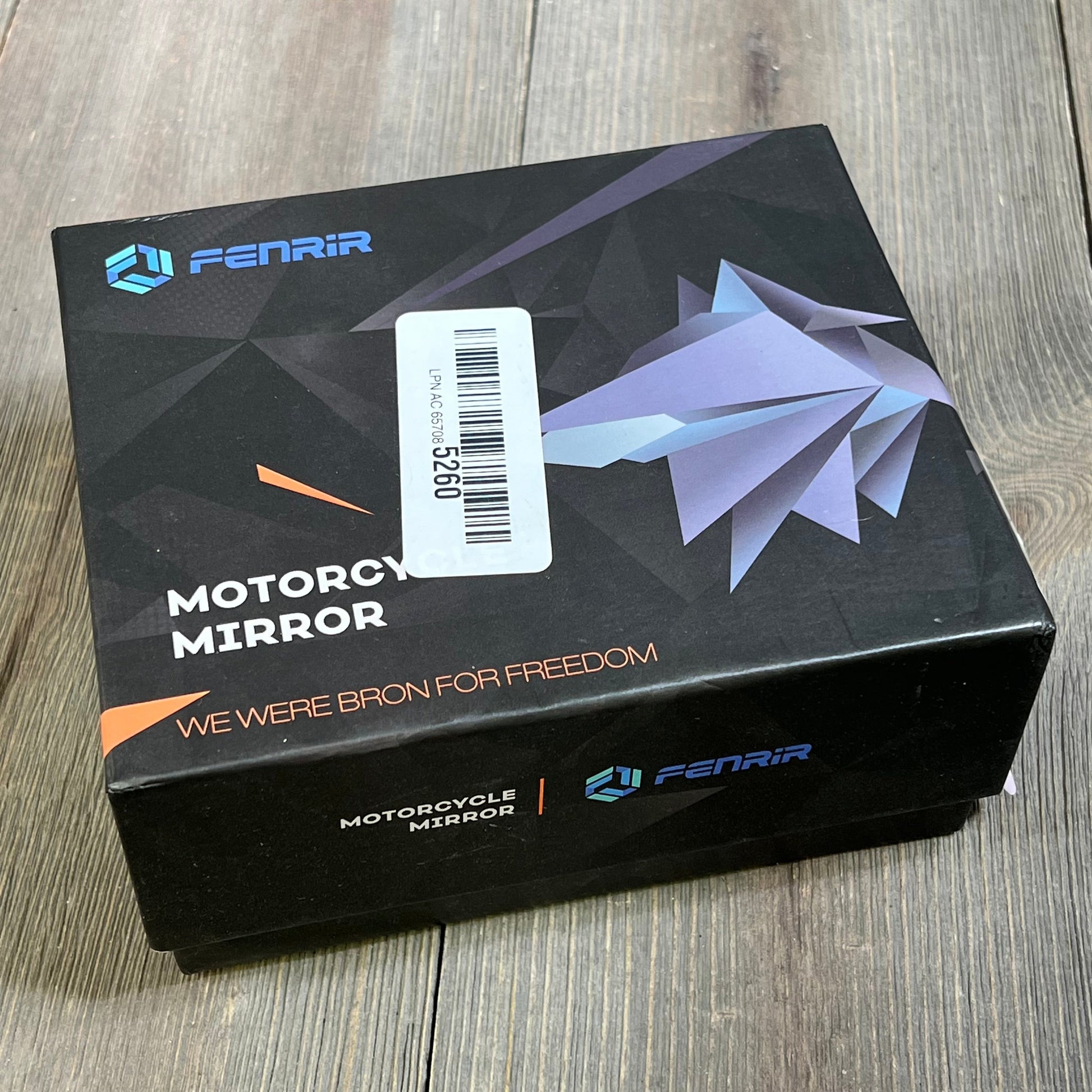 FENRIR CNC Aluminum Alloy Motorcycle Bar End Mirrors packaging on wooden surface, showcasing sleek design and branding.