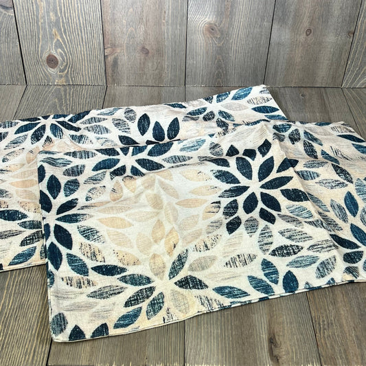 Navy blue cream dahlia lumbar pillow covers with geometric floral design on rustic wood background, perfect for outdoor decor.