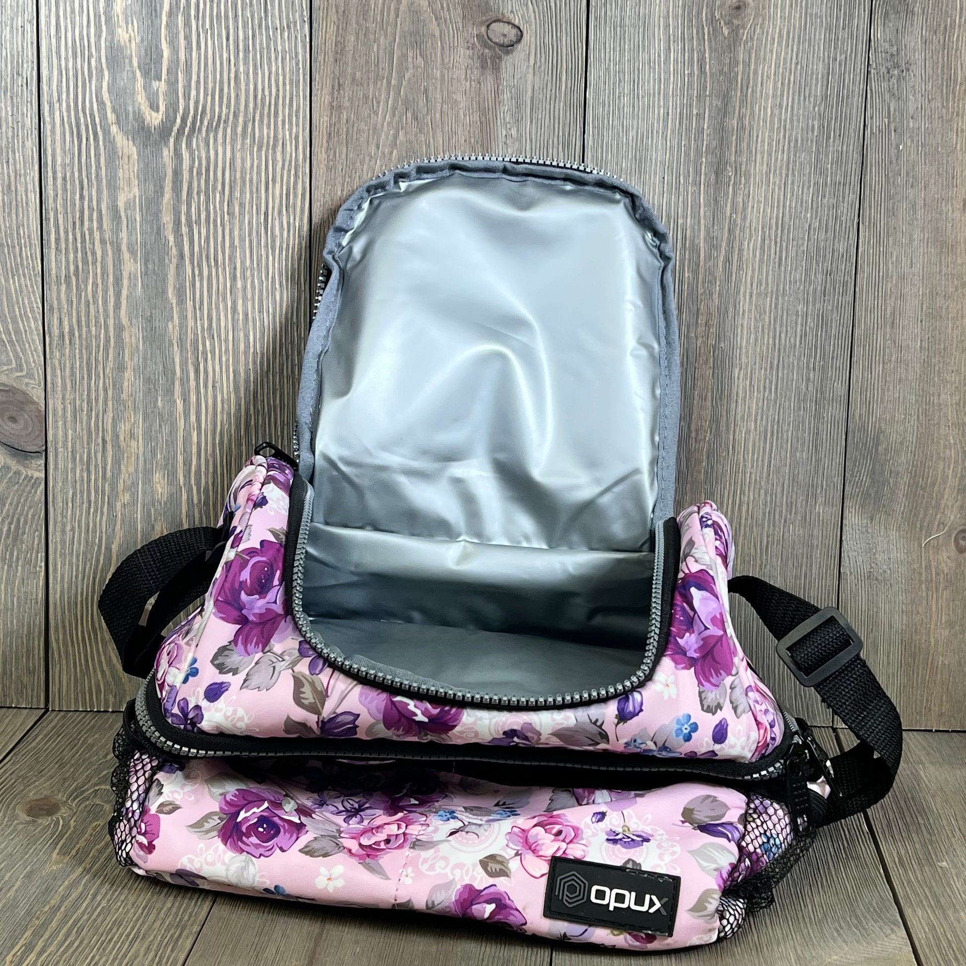 Floral purple Opux lunch box with large dual compartments, open to show insulated interior, ideal for women.